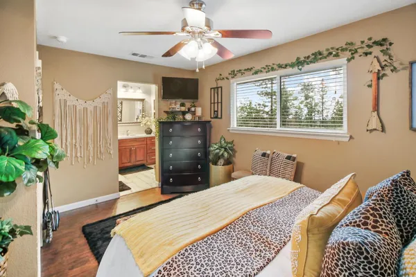 a spacious bathroom with a granite countertop sink mirror and shower