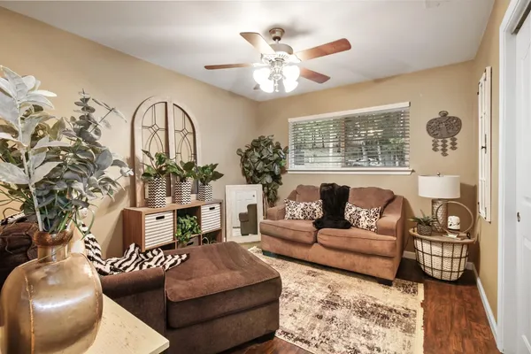 a bathroom with a toilet and a shower curtain