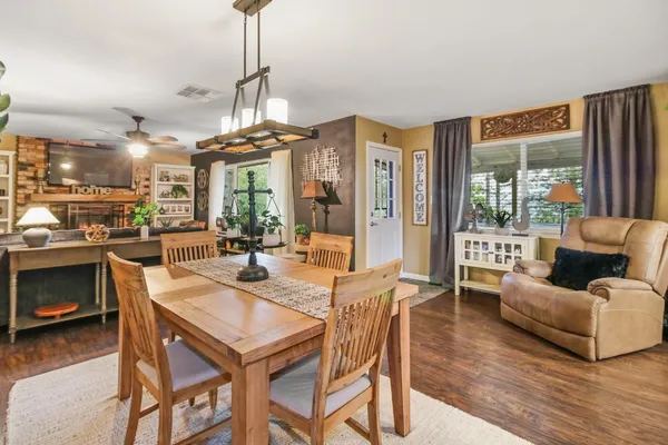 a living room with lots of furniture and a chandelier