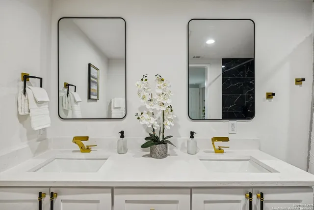 a bathroom with a sink and a mirror