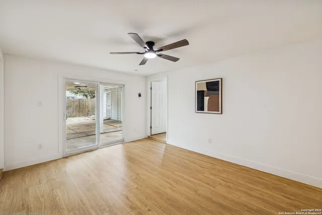 a view of an empty room with glass door