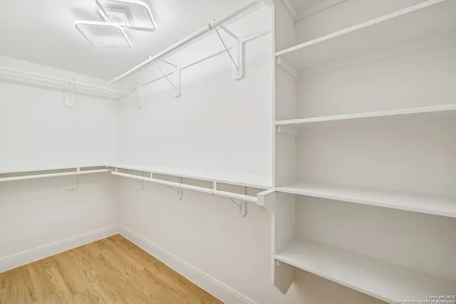 a view of an empty walk in closet
