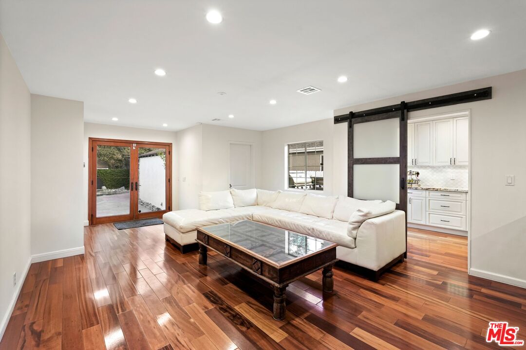 5324 Irvine Avenue Valley Village, CA 91601 - Photo 11 of 33 a living room with furniture and wooden floor
