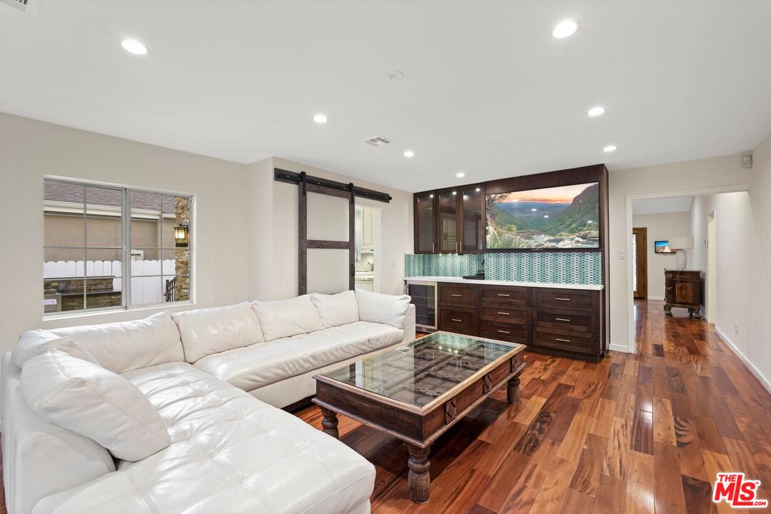 5324 Irvine Avenue Valley Village, CA 91601 - Photo 12 of 33 a living room with furniture and a table