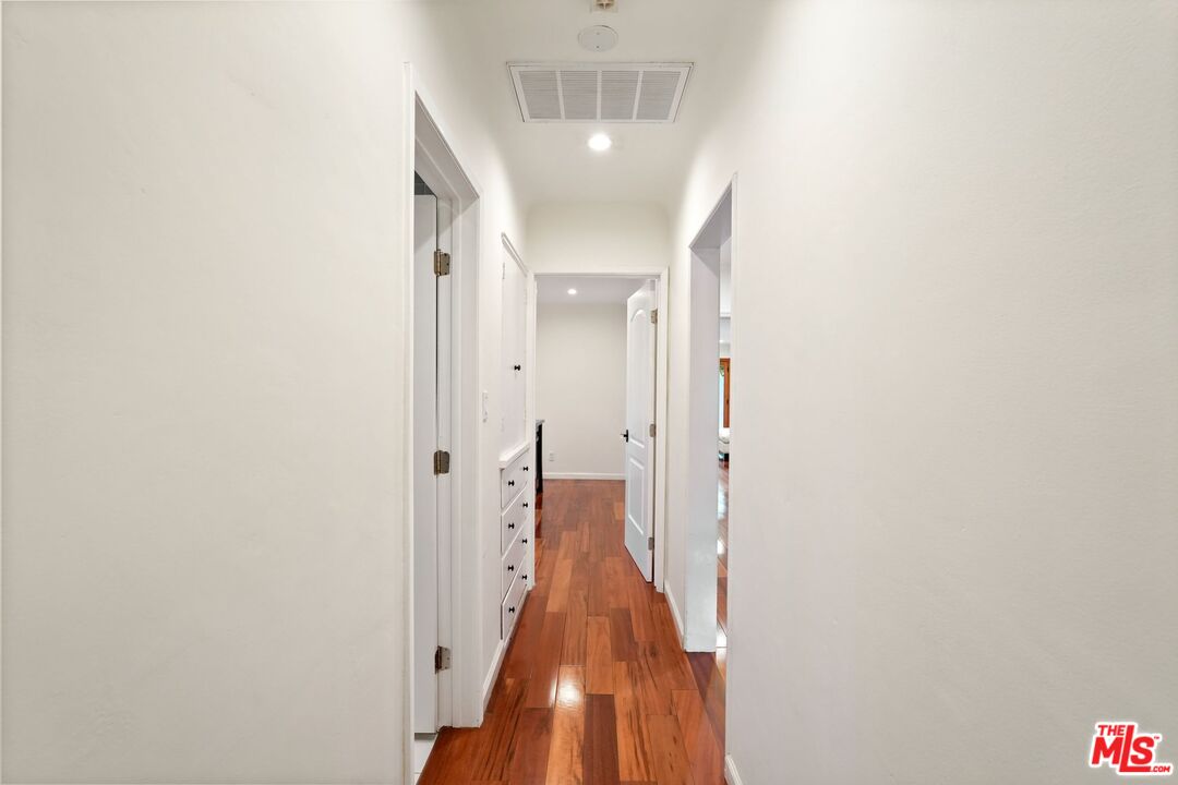 5324 Irvine Avenue Valley Village, CA 91601 - Photo 18 of 33 a view of a hallway with wooden floor