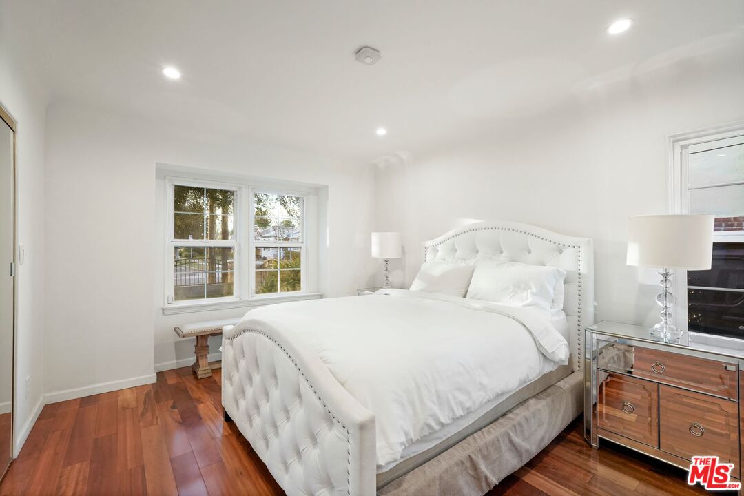 5324 Irvine Avenue Valley Village, CA 91601 - Photo 19 of 33 a bedroom with a bed and a flat tv screen on dresser