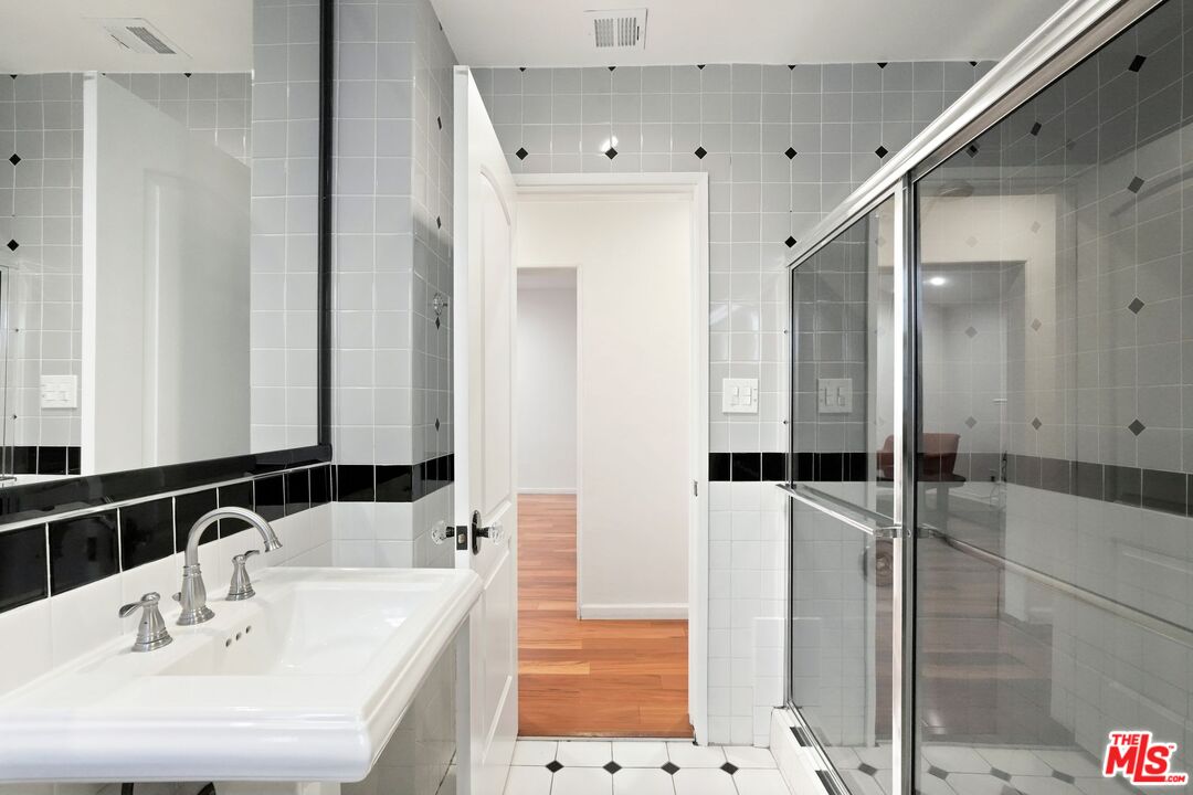 5324 Irvine Avenue Valley Village, CA 91601 - Photo 22 of 33 a bathroom with a bathtub and a sink