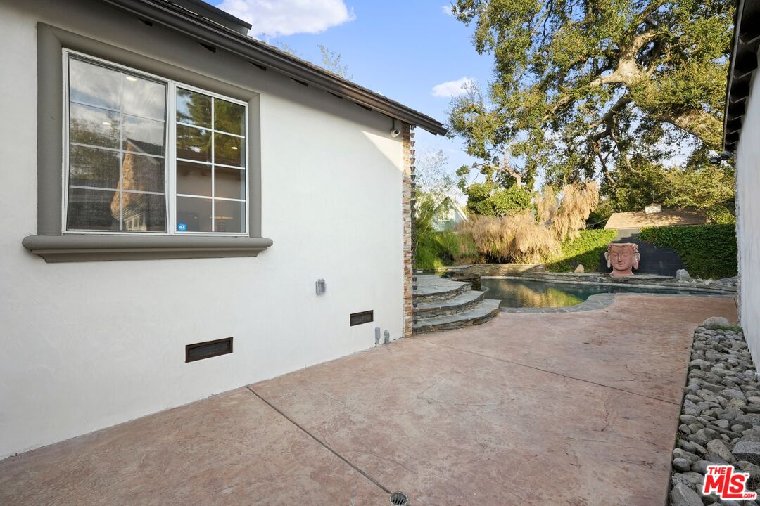 5324 Irvine Avenue Valley Village, CA 91601 - Photo 24 of 33 a view of a house with backyard and tree