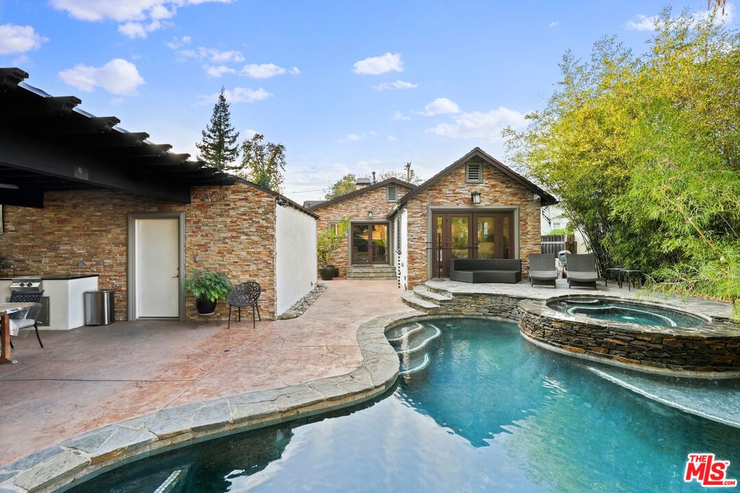5324 Irvine Avenue Valley Village, CA 91601 - Photo 29 of 33 a front view of a house with swimming pool having outdoor seating