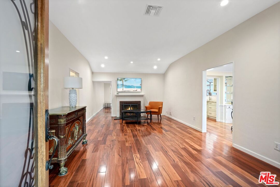 5324 Irvine Avenue Valley Village, CA 91601 - Photo 3 of 33 a living room with furniture and a fireplace