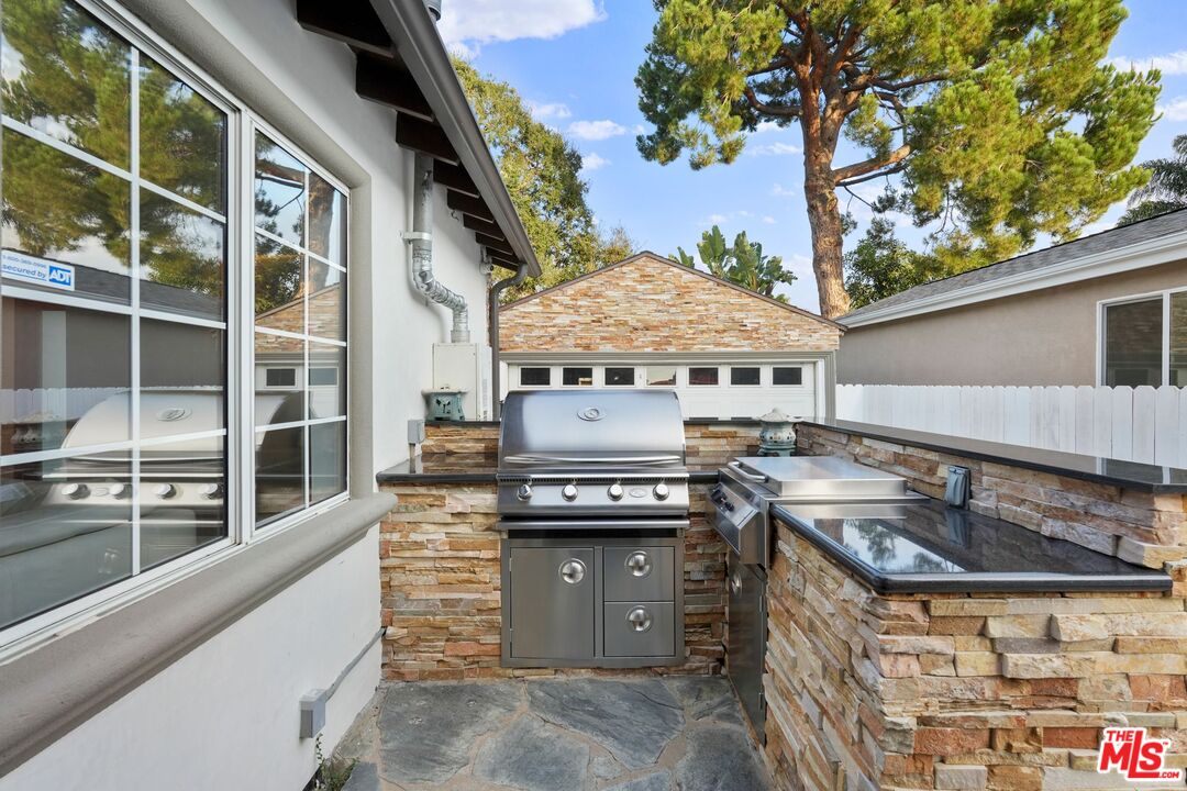 5324 Irvine Avenue Valley Village, CA 91601 - Photo 32 of 33 a kitchen with a stove and a microwave