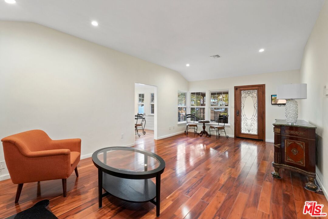 5324 Irvine Avenue Valley Village, CA 91601 - Photo 4 of 33 a living room with furniture and a wooden floor
