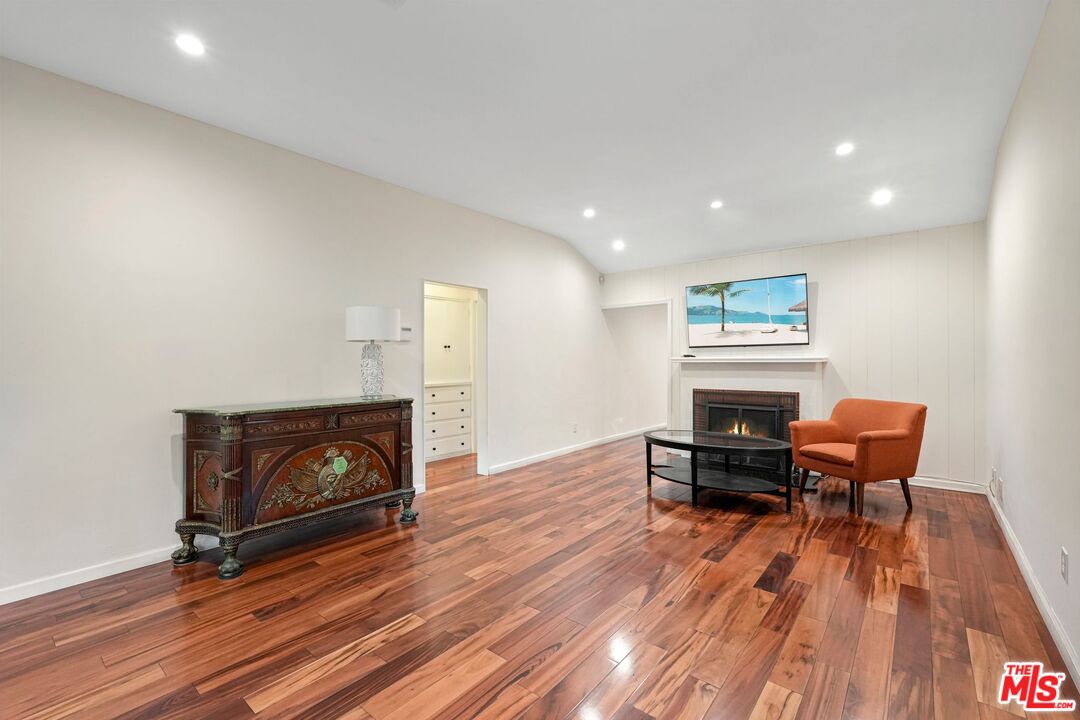 5324 Irvine Avenue Valley Village, CA 91601 - Photo 5 of 33 a living room with furniture and a fireplace