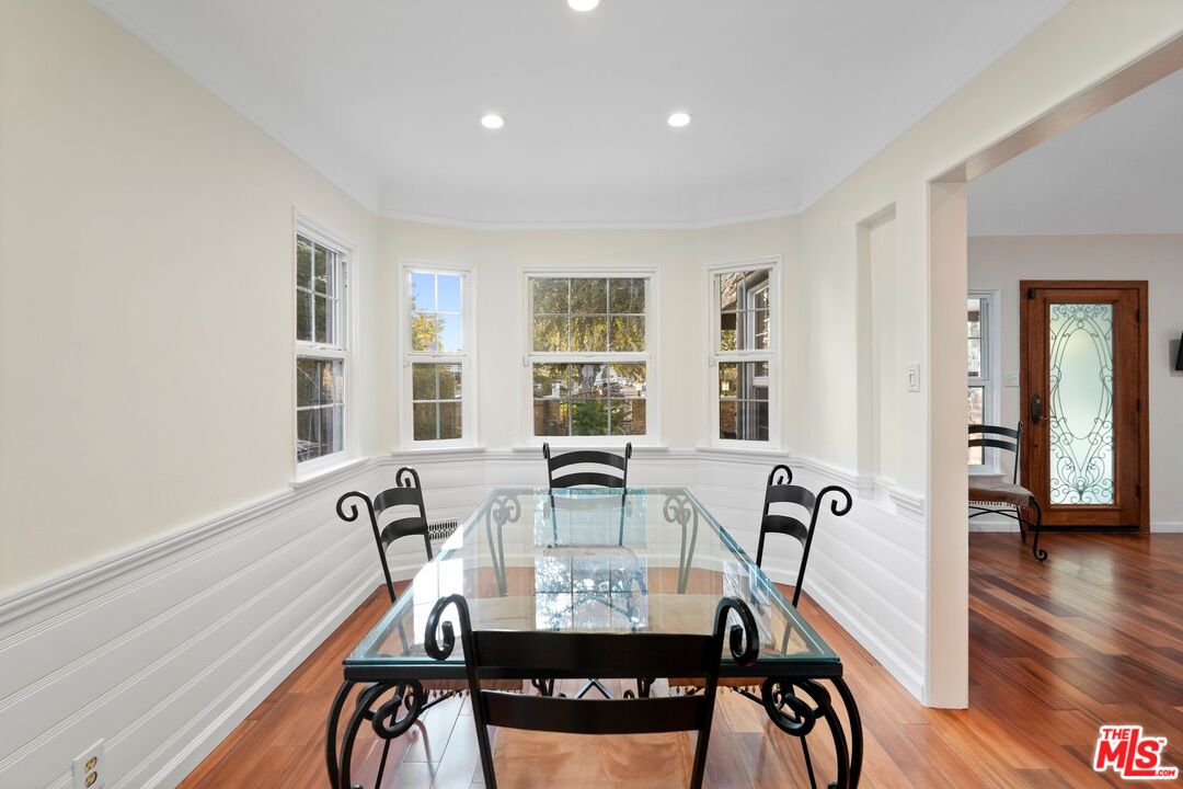 5324 Irvine Avenue Valley Village, CA 91601 - Photo 6 of 33 a view of a dining room with furniture window and wooden floor