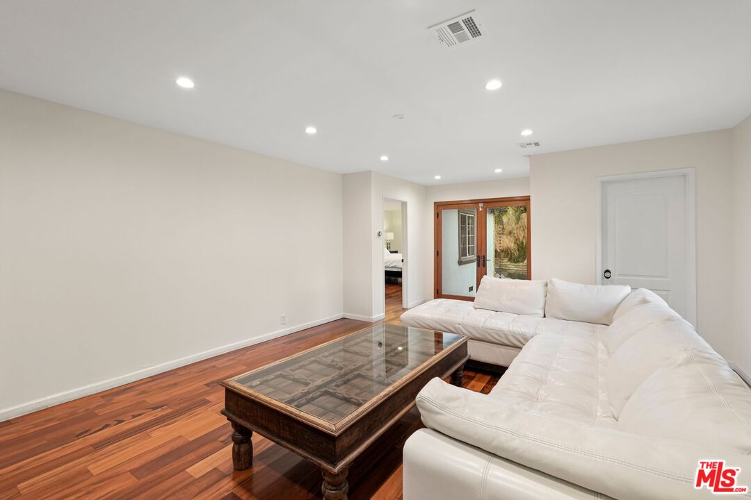 5324 Irvine Avenue Valley Village, CA 91601 - Photo 10 of 33 a living room with furniture and a wooden floor