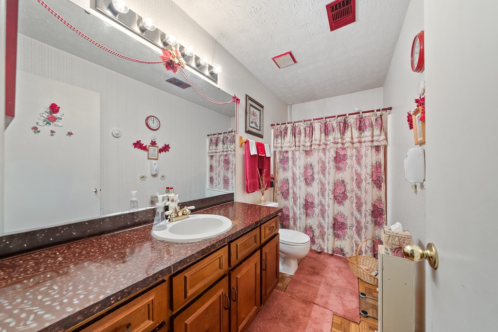 6223 Georgetown Drive Columbus, GA 31907 - Photo 15 of 29 a bathroom with a sink vanity and a mirror