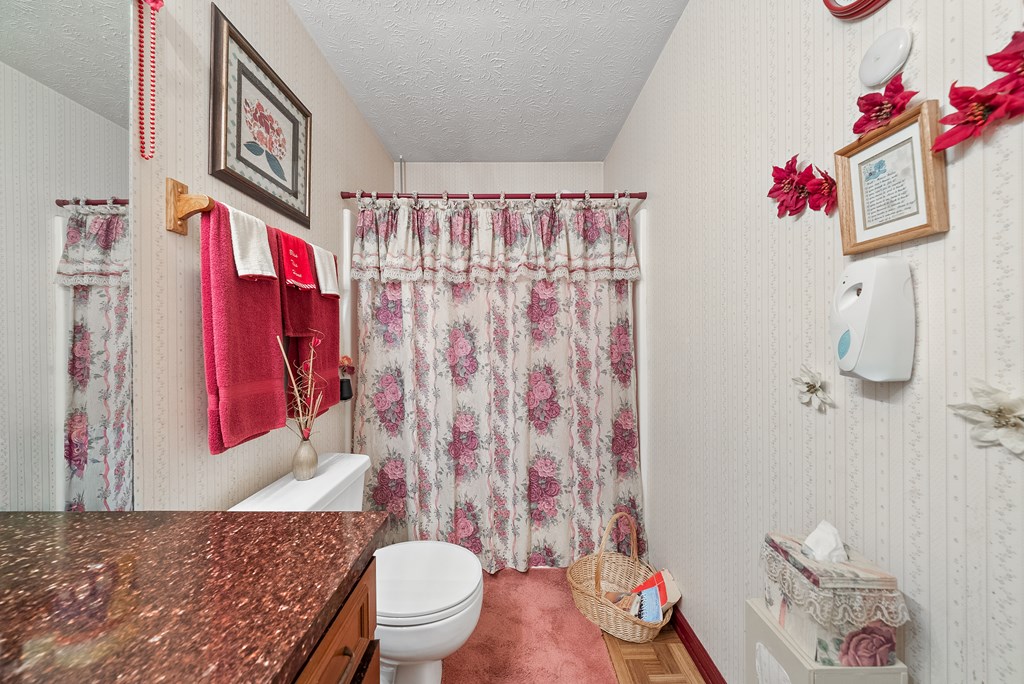 6223 Georgetown Drive Columbus, GA 31907 - Photo 16 of 29 a bathroom with a sink toilet and shower
