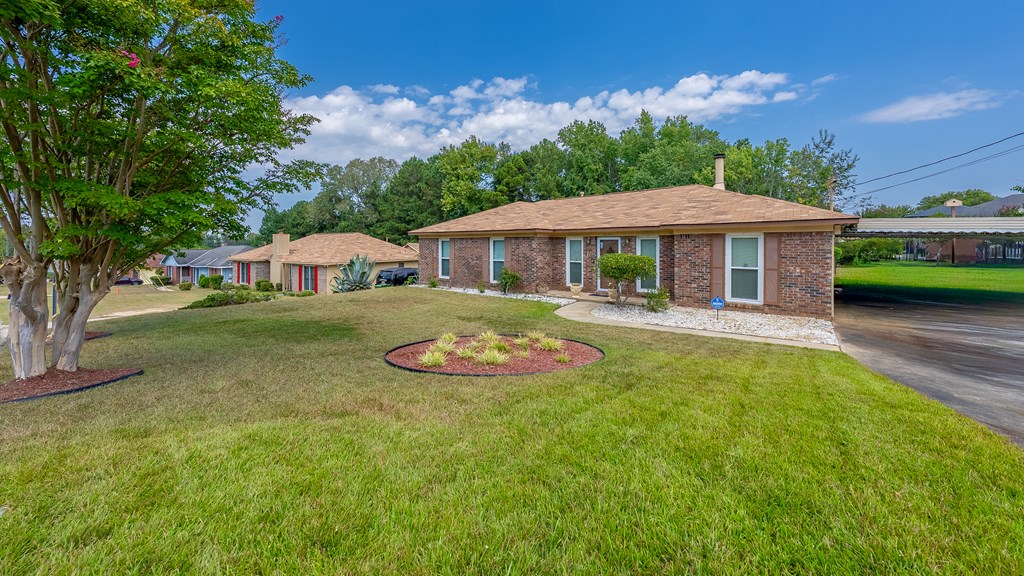 6223 Georgetown Drive Columbus, GA 31907 - Photo 2 of 29 a view of house with garden and swimming pool