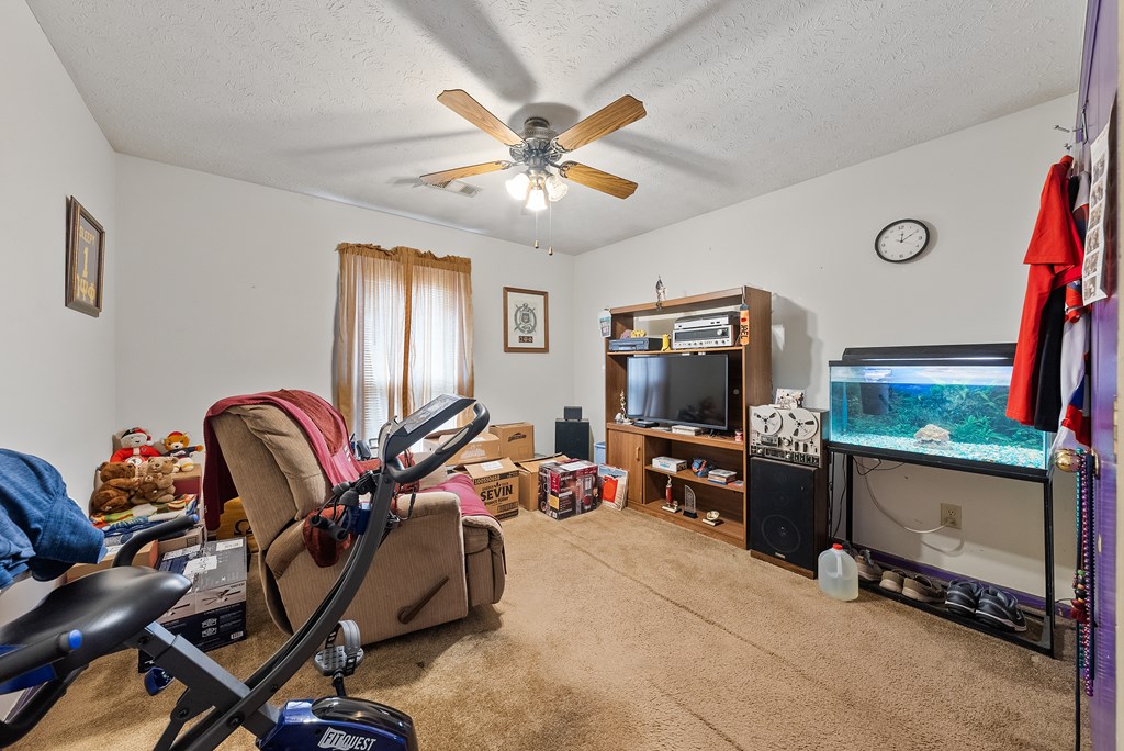 6223 Georgetown Drive Columbus, GA 31907 - Photo 23 of 29 a living room with furniture and a flat screen tv