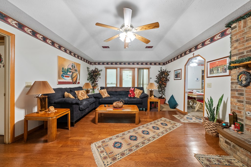 6223 Georgetown Drive Columbus, GA 31907 - Photo 6 of 29 a living room with furniture and a chandelier