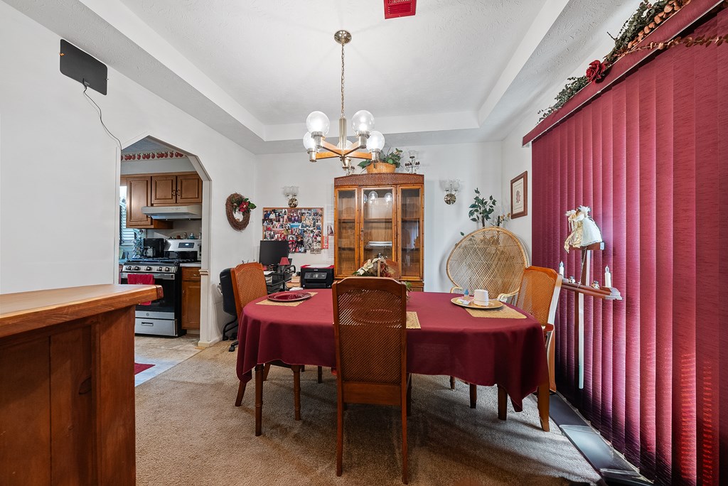 6223 Georgetown Drive Columbus, GA 31907 - Photo 8 of 29 a view of a dining room with furniture and chandelier