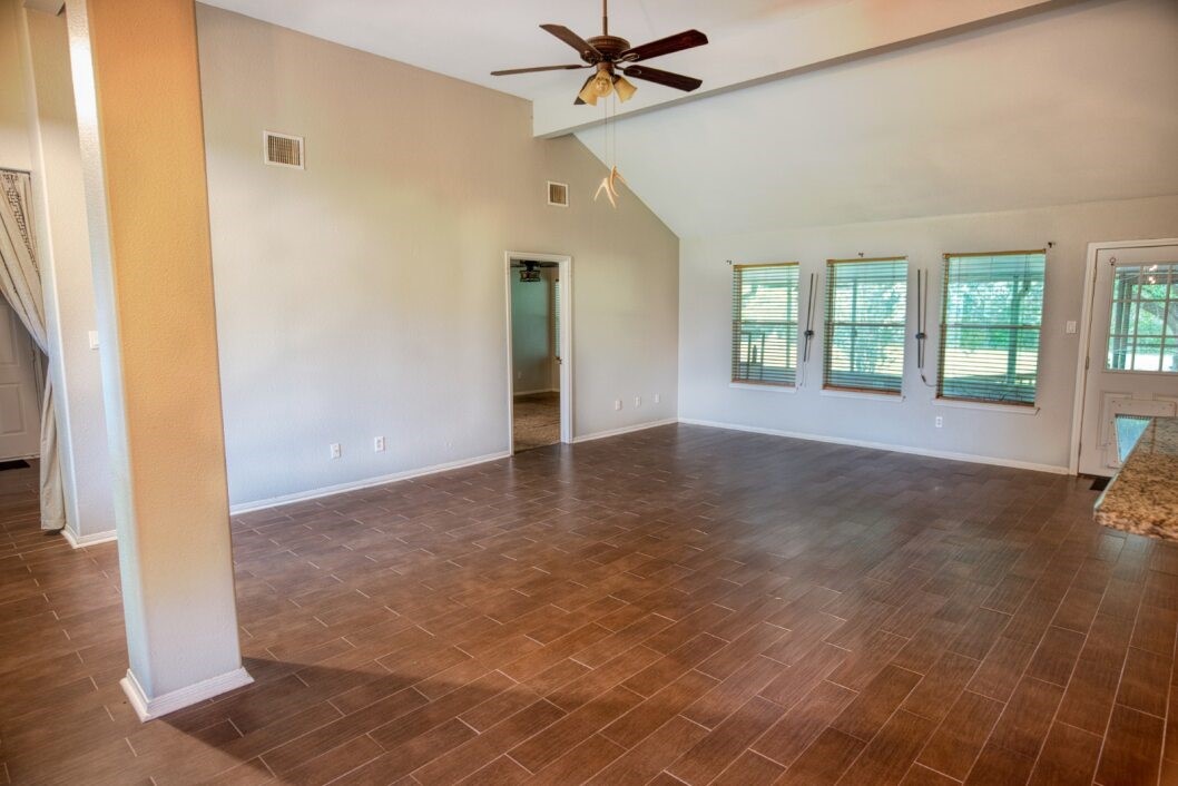 308 County Road 893B Angleton, TX 77515 - Photo 14 of 41 a view of an empty room with window and wooden floor