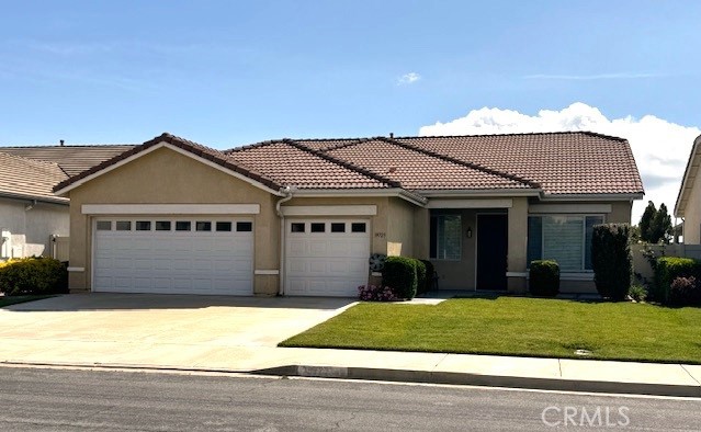 a view of a house with a garden and entryway
