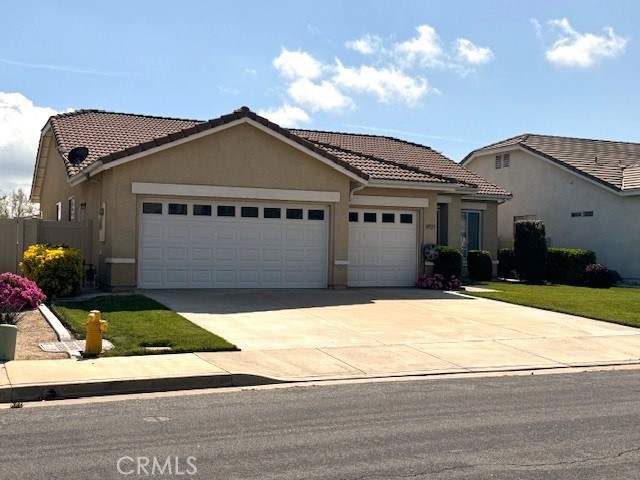 39723 Clements Way Murrieta, CA 92563 - Photo 2 of 20 a front view of a house with garage