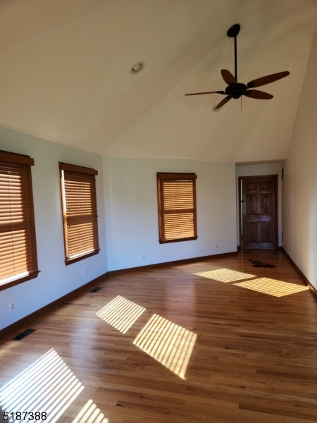 122 Boss Road, Unit B Stockton, NJ 08559 - Photo 9 of 10 a view of an empty room with window and wooden floor