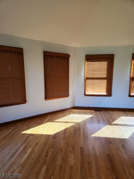 122 Boss Road, Unit B Stockton, NJ 08559 - Photo 10 of 10 a view of an empty room with wooden floor and a window