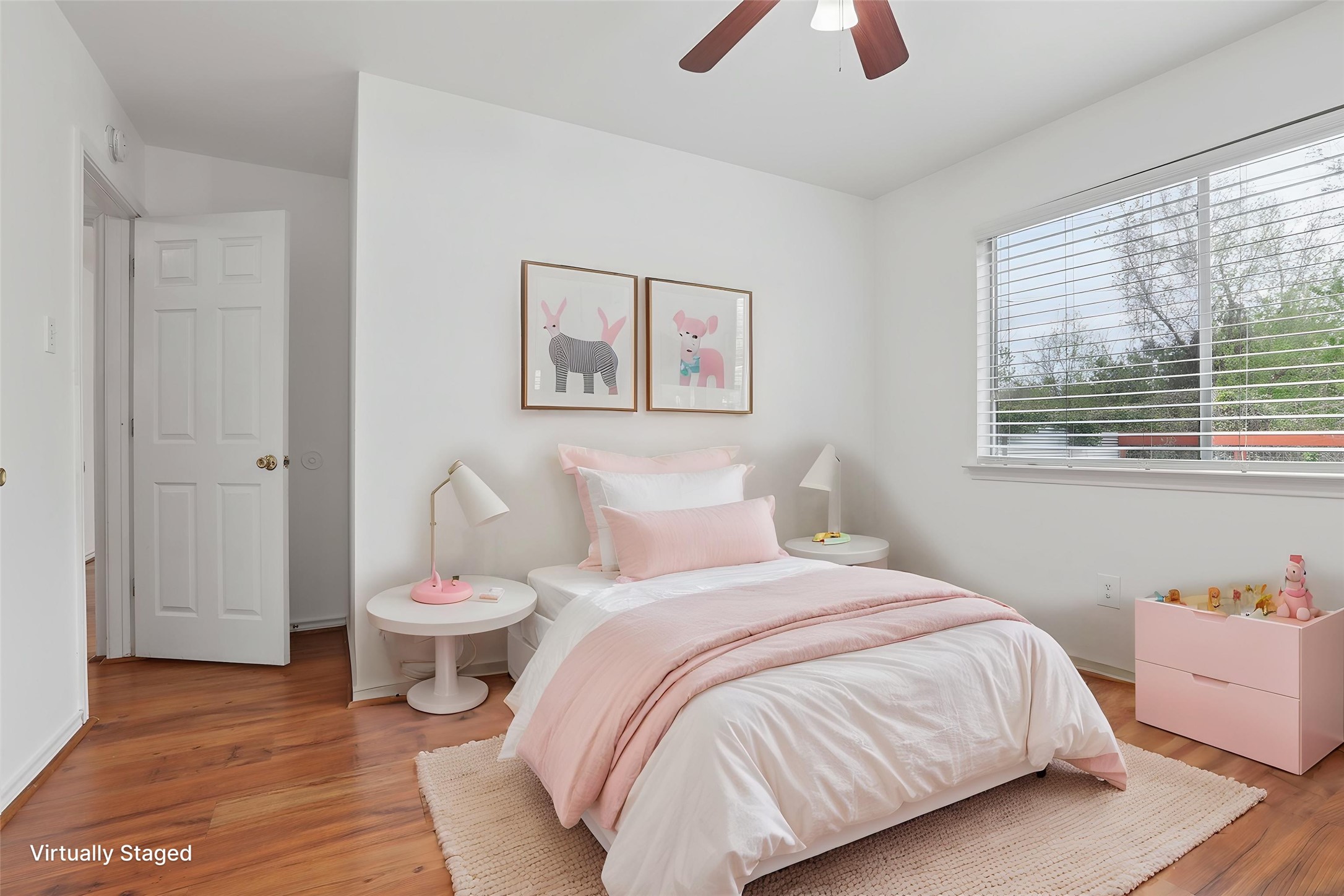 12319 Turtle Rock Road, Unit B Austin, TX 78729 - Photo 15 of 26 a bedroom with a bed and a chandelier