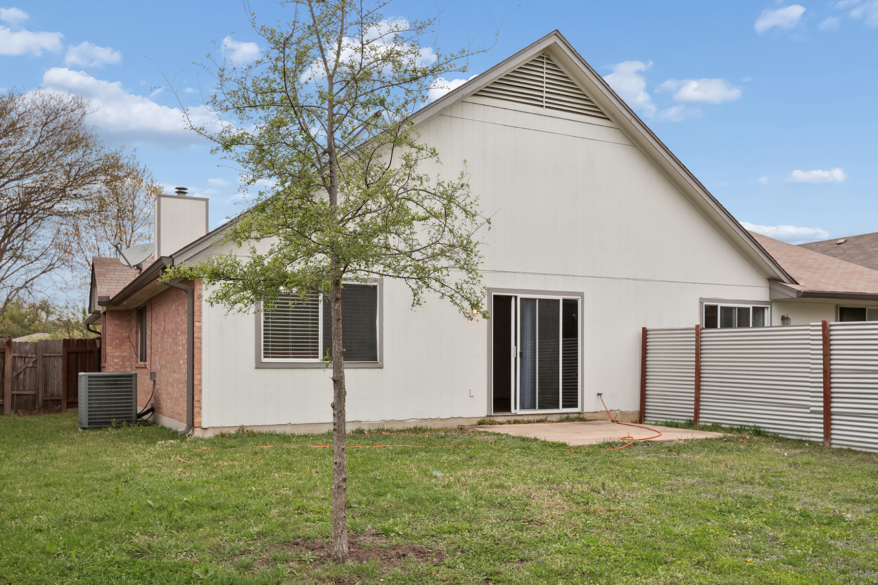 12319 Turtle Rock Road, Unit B Austin, TX 78729 - Photo 22 of 26 a backyard of a house