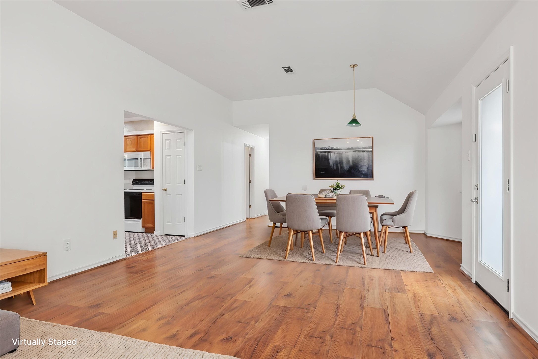 12319 Turtle Rock Road, Unit B Austin, TX 78729 - Photo 6 of 26 a view of a dining room with furniture and wooden floor