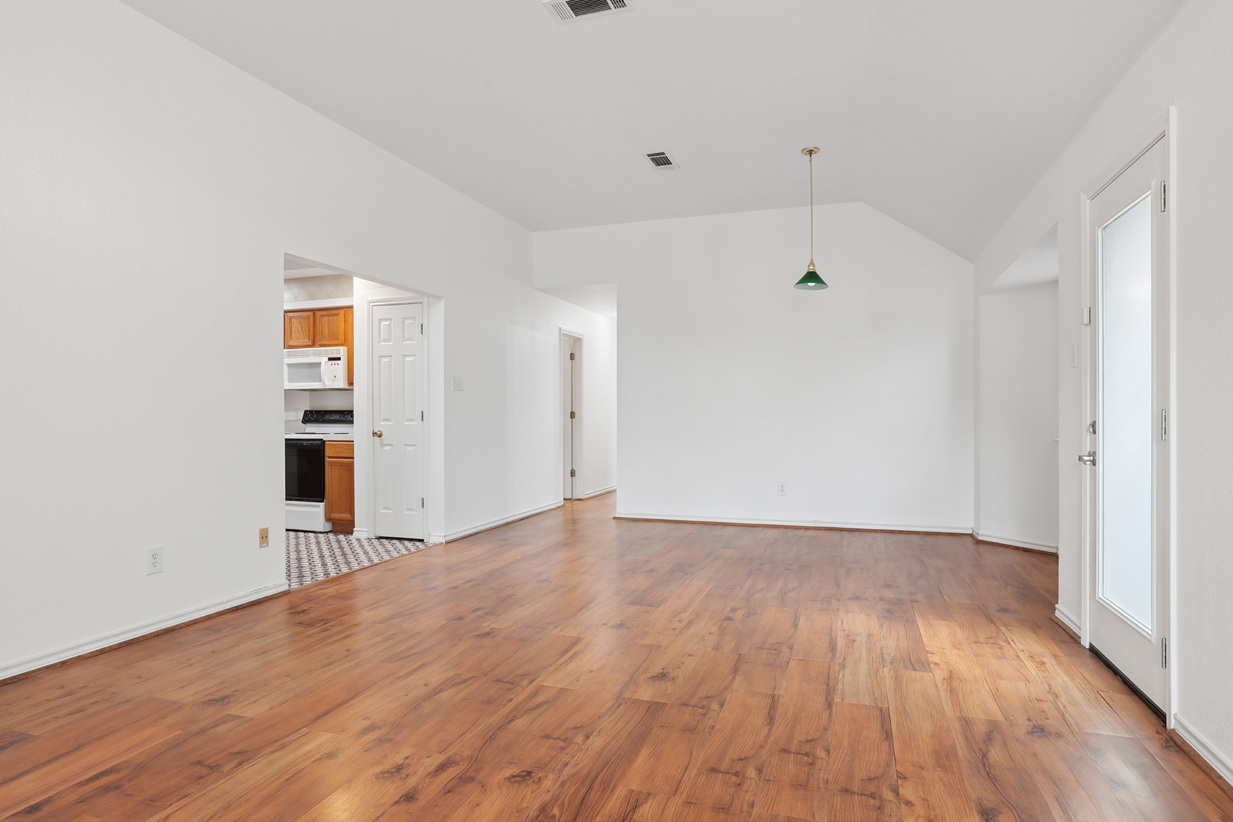 12319 Turtle Rock Road, Unit B Austin, TX 78729 - Photo 7 of 26 wooden floor in an empty room