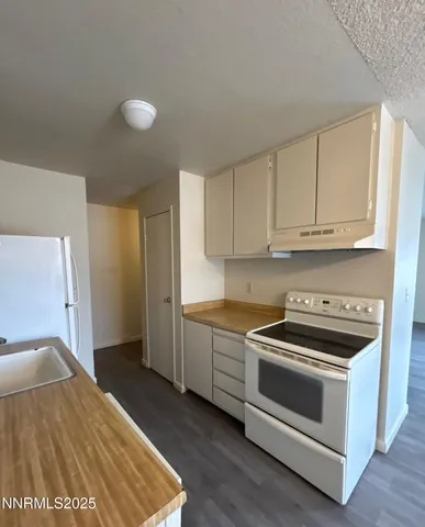 a kitchen with a stove and a sink
