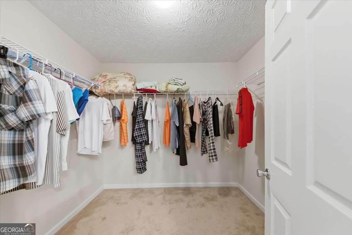 3867 Riverside Parkway Decatur, GA 30034 - Photo 13 of 23 a view of walk in closet with clothes and shoes