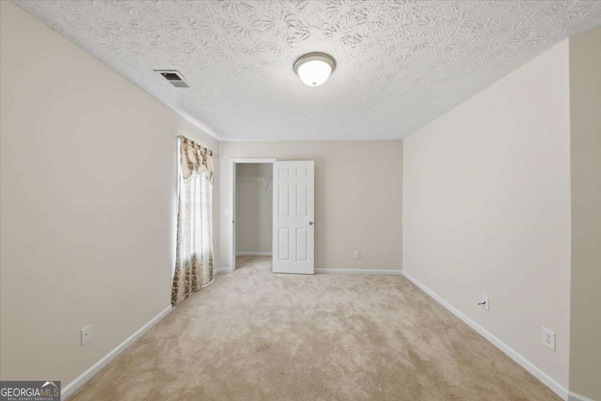 3867 Riverside Parkway Decatur, GA 30034 - Photo 18 of 23 an empty room with a natural light