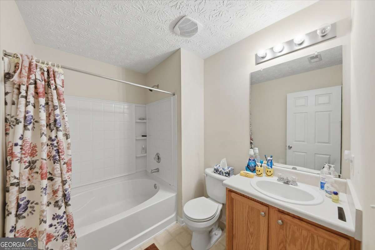 3867 Riverside Parkway Decatur, GA 30034 - Photo 19 of 23 a bathroom with a sink toilet and shower