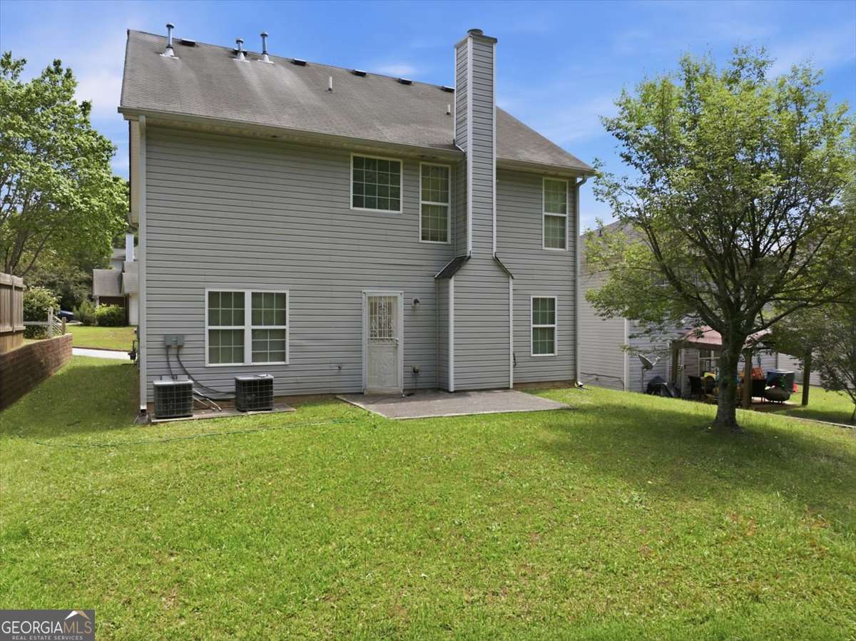 3867 Riverside Parkway Decatur, GA 30034 - Photo 20 of 23 a view of a house with a backyard