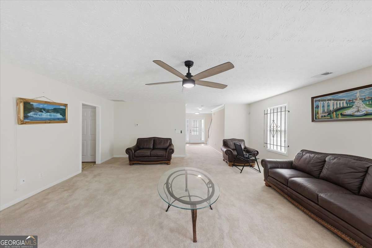 3867 Riverside Parkway Decatur, GA 30034 - Photo 5 of 23 a living room with furniture and a ceiling fan