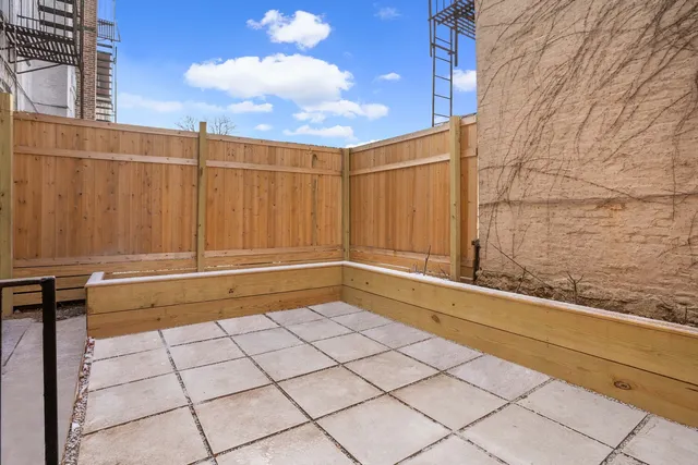a view of kitchen with stainless steel appliances a refrigerator and a stove top oven