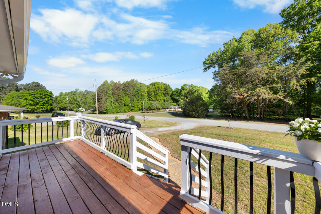 454 Cedar Creek Road Timberlake, NC 27583 - Photo 7 of 39 a view of balcony with wooden floor and fence