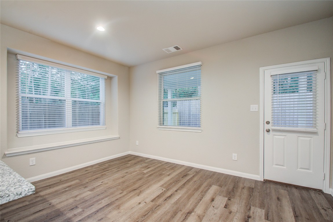 3620 Cub Drive Conroe, TX 77301 - Photo 14 of 49 a view of an empty room with wooden floor and a window
