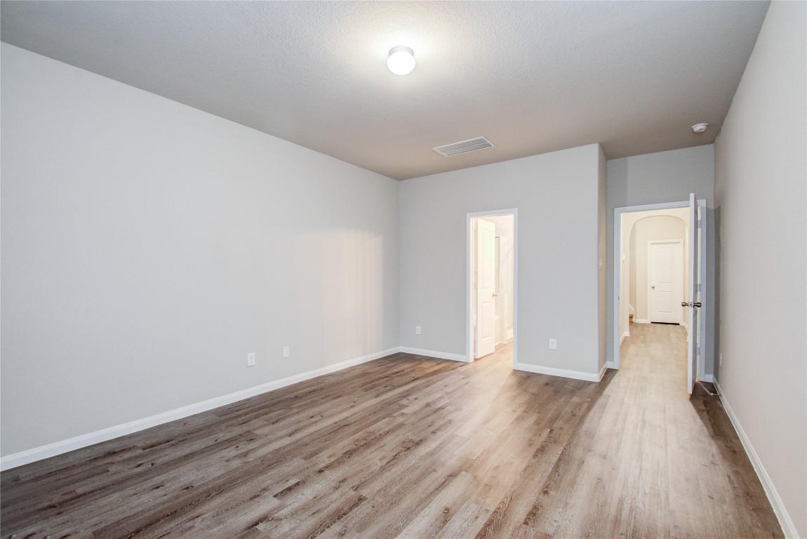 3620 Cub Drive Conroe, TX 77301 - Photo 17 of 49 a view of an empty room with wooden floor