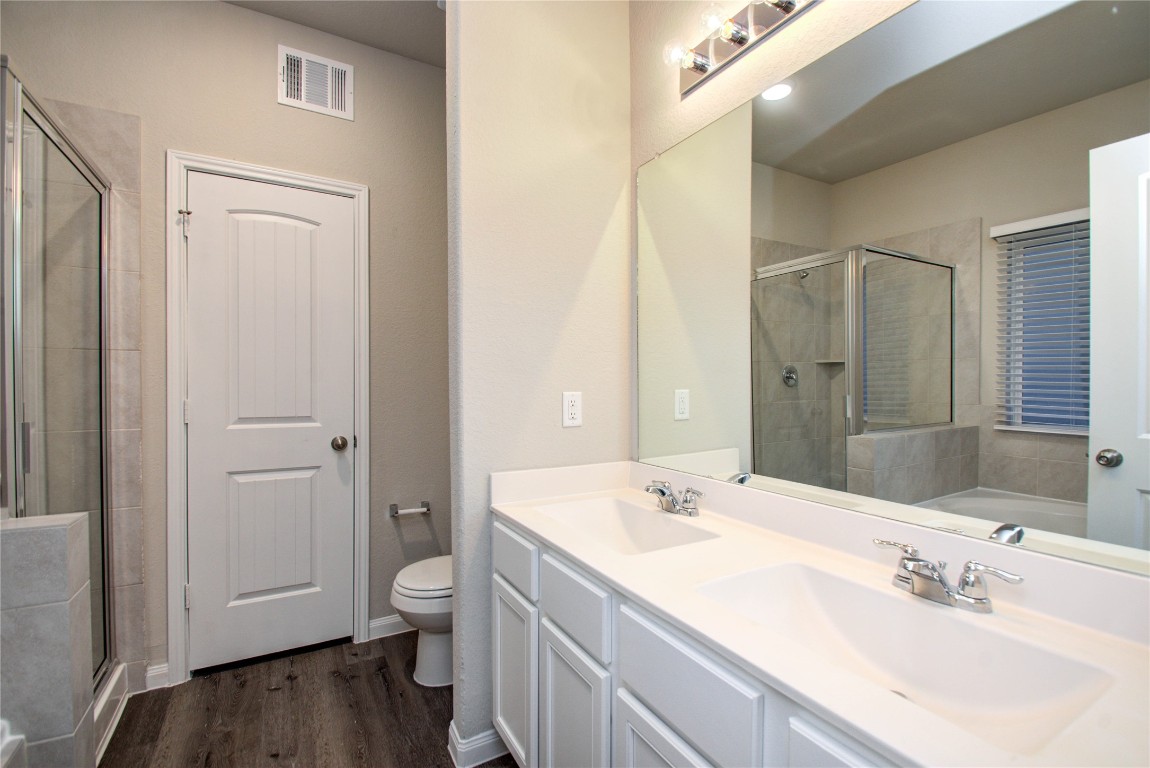 3620 Cub Drive Conroe, TX 77301 - Photo 18 of 49 a bathroom with a double vanity sink and a mirror