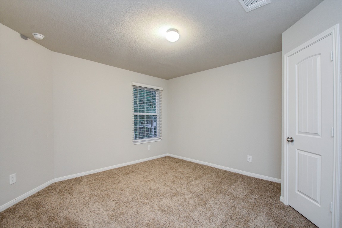 3620 Cub Drive Conroe, TX 77301 - Photo 32 of 49 an empty room with a window