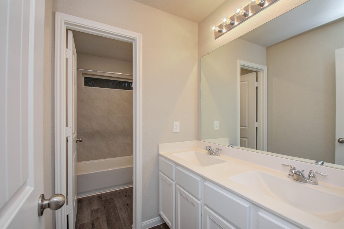 3620 Cub Drive Conroe, TX 77301 - Photo 33 of 49 a bathroom with a sink a mirror and a shower