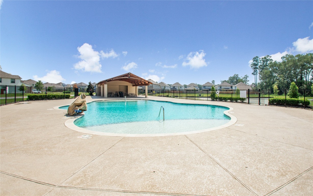 3620 Cub Drive Conroe, TX 77301 - Photo 36 of 49 a view of a swimming pool and a yard