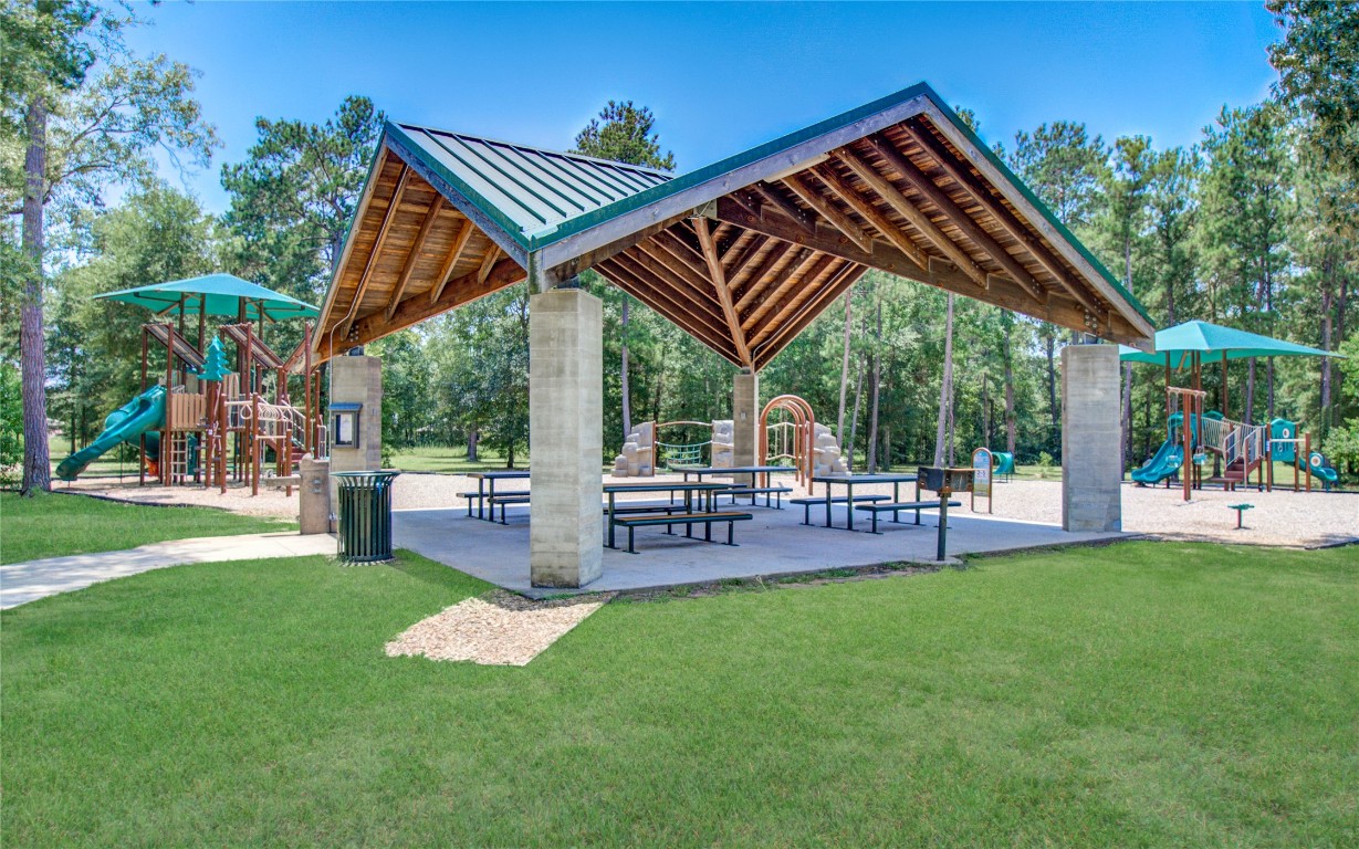 3620 Cub Drive Conroe, TX 77301 - Photo 45 of 49 a view of a backyard with a patio and outdoor seating