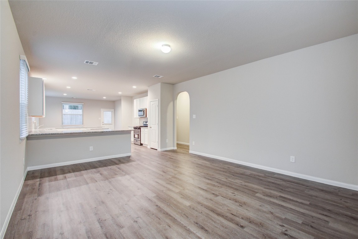 3620 Cub Drive Conroe, TX 77301 - Photo 5 of 49 a view of an empty room with wooden floor and a window